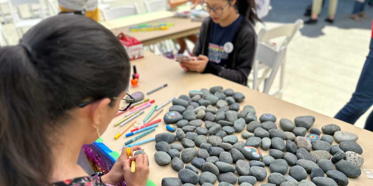 Students paint rocks various colours to support EDI at Royal Roads