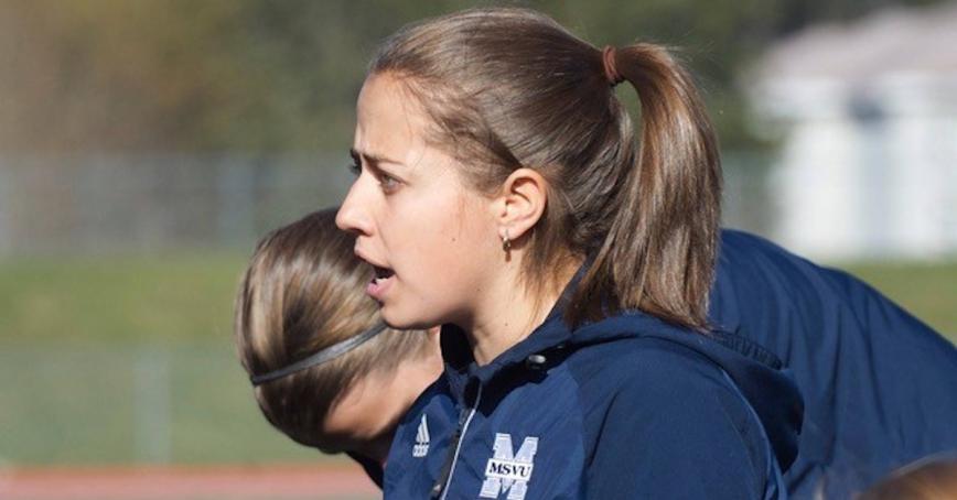 Varsity soccer Head Coach Danielle Cyr talking to players on the field. Photo courtesy of Mount Saint Vincent University.