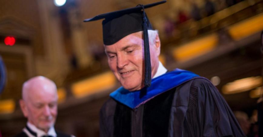 Professor Emeritus Michael Real dressed in regalia during a convocation ceremony