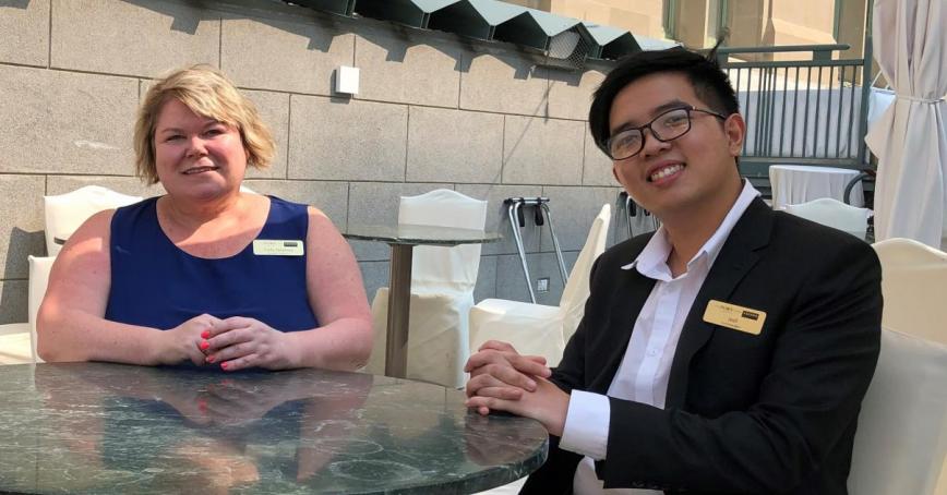 picture of Cathy and Josh at a patio table