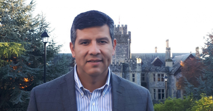 Head shot of Juan Navarro with Hatley Castle in the background