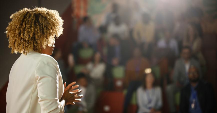 Female addressing an audience