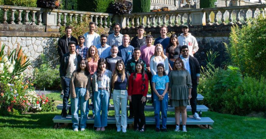 BBA students standing in the Italian gardens on campus.