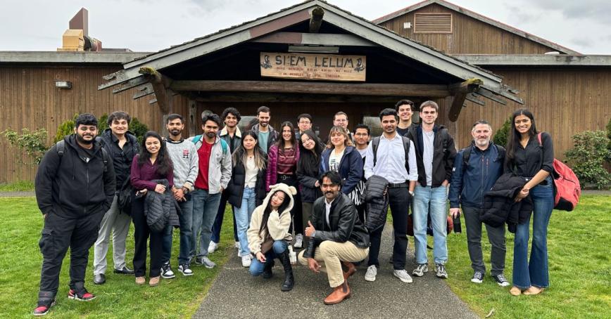 Group of BBA students standing in front of Cowichan Tribes building.