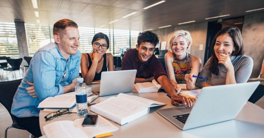 students working together on their computers