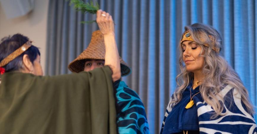 Tasha Brooks standing during ceremony at Indigenous Graduation. 