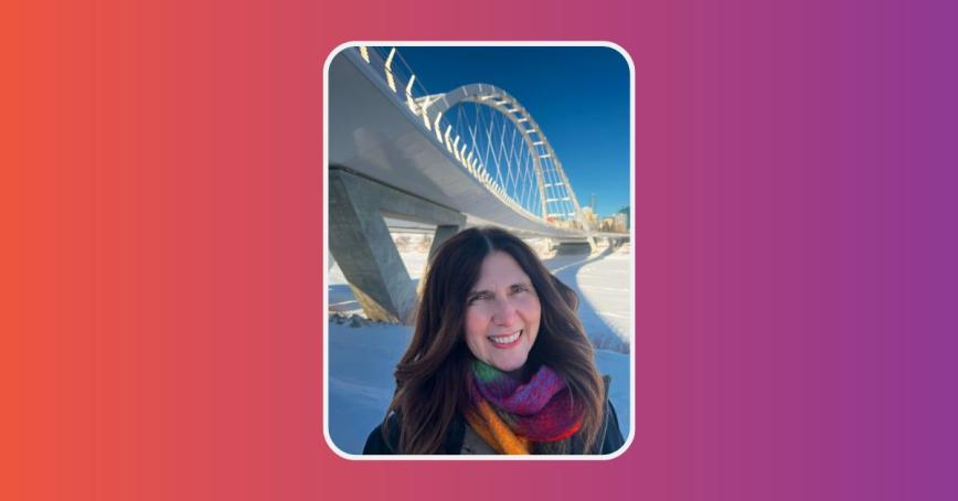 Bree Claude with a white bridge pictured behind her and snow on the ground.