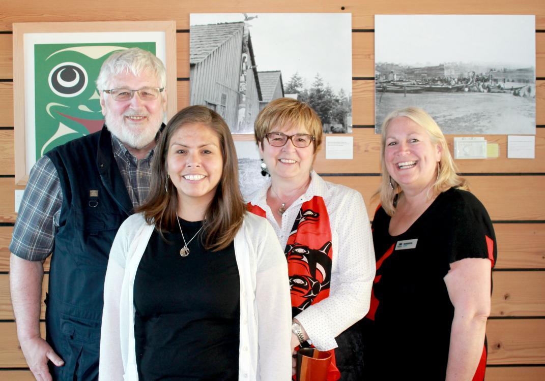 Smith family standing in front of works of art