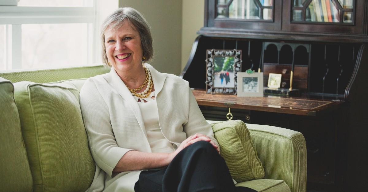 Janice Loper sitting on a couch