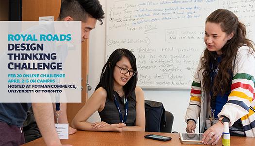 Three students looking at a phone.