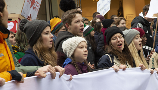 Climate action leader Greta Thunberg in crowd of climate protestors