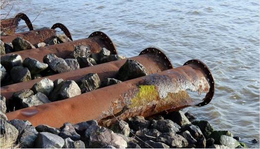 five-metal-pipes-extending-into-the-ocean