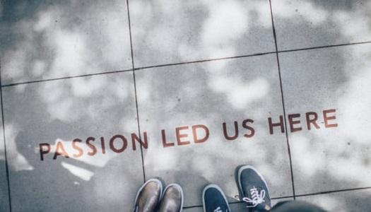 sign-on-sidewalk-passion-led-us-here