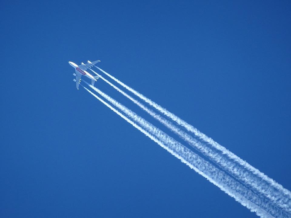 Airplane with contrails