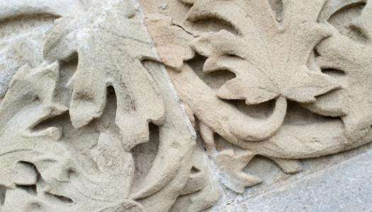 Architectural detail of oak leaves carved in stone