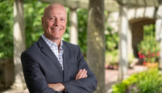 Philip Steenkamp standing in Italian garden at Royal Roads University