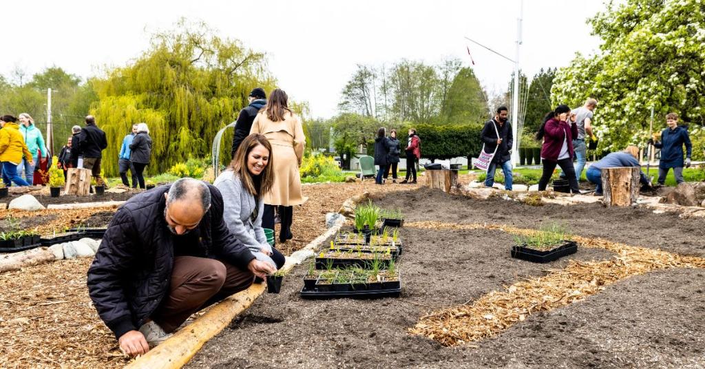 A group of Royal Roads community members helps to plant the Indigenous Medicine Garden