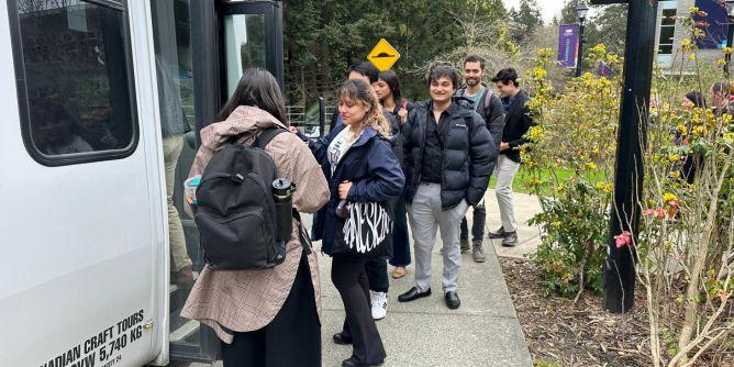 Students queuing up to go on a bus to Duncan, BC.