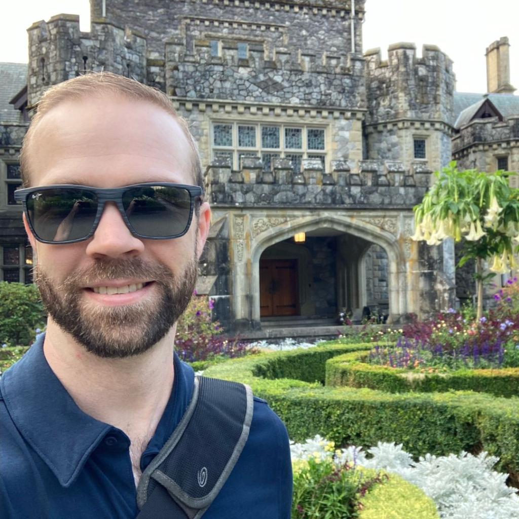 MBA student Don Coleman poses in front of Hatley Castle