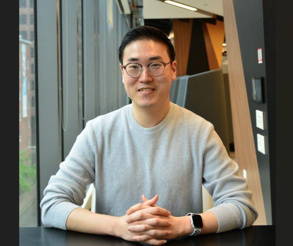 Taejo Kim smiling in an office environment