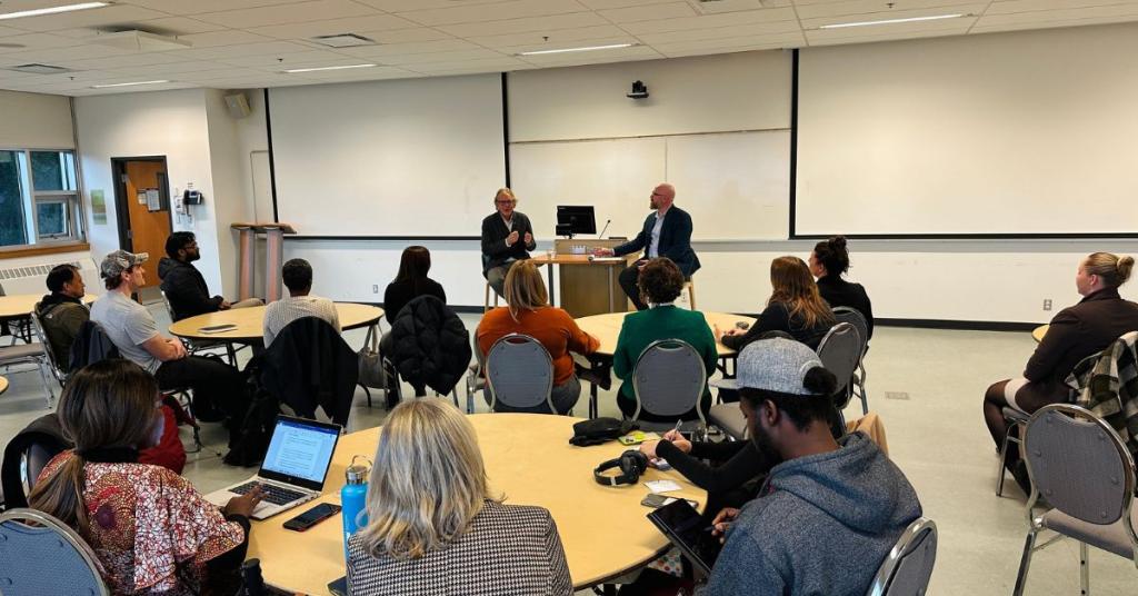 Anthony von Mandl speaking to a classroom of business students.