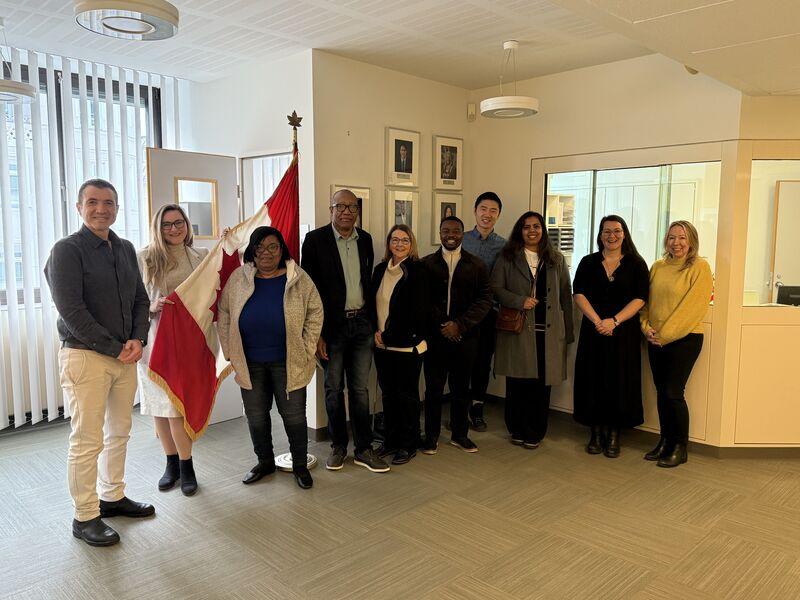 Students pose for a photo at the Canadian consulate in Munich