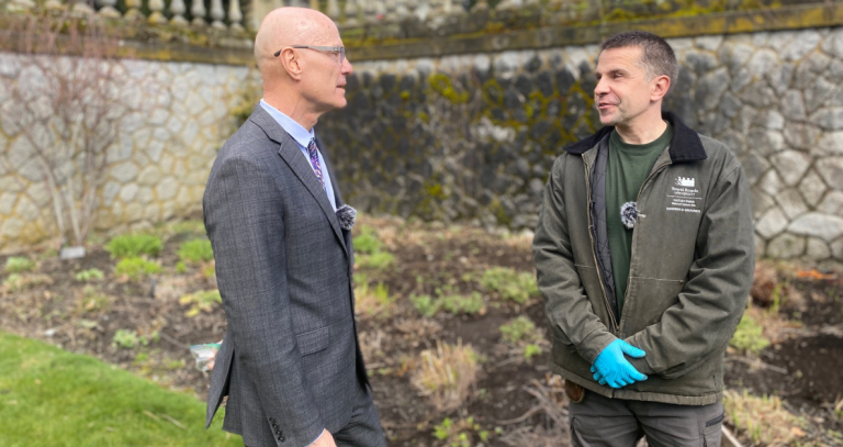 President Steenkamp and Gardener Vasek Kran speak in the RRU Italian Garden.