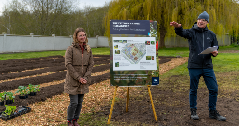 Solara Goldwynn and Philip Steenkamp stand in front of RRU's new Kitchen Garden plot.