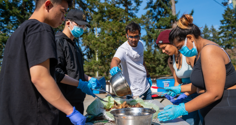 Students sort through garbage for a waste-reduction project.