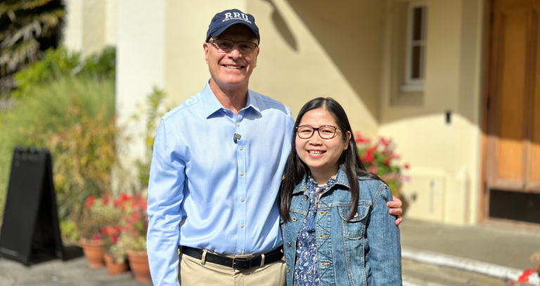 President Philip Steenkamp poses with student Marilyn Licudan.