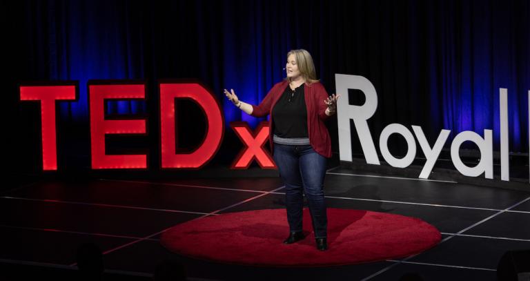 Candice Neveu talking on stage at TEDx Royal Roads.