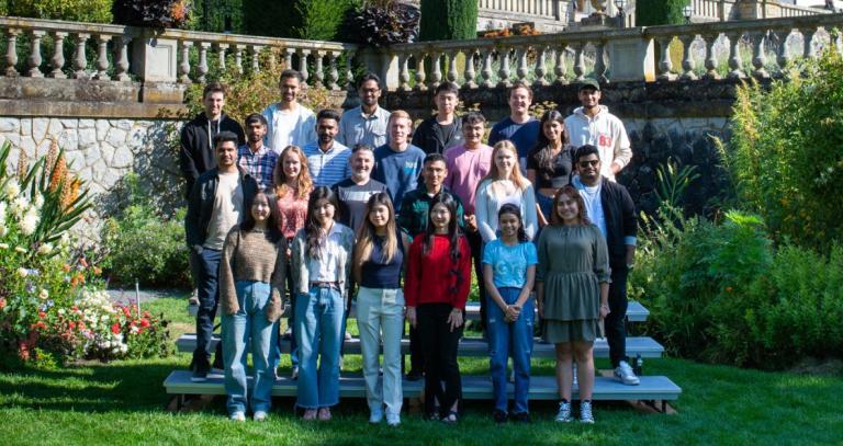 BBA students standing in the Italian gardens on campus.