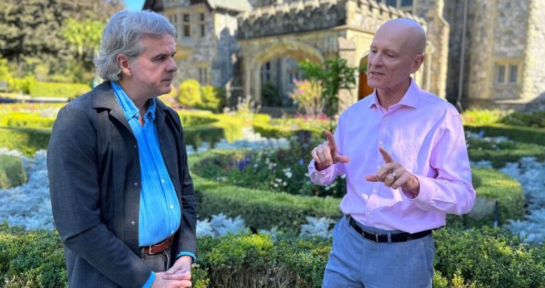 Dr. David Black in conversation with President Steenkamp in front of Hatley Castle