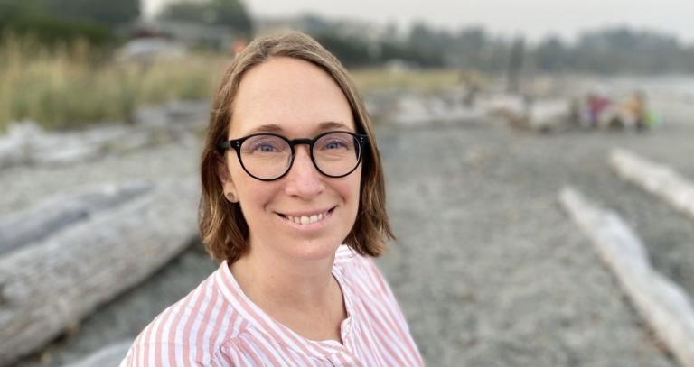 Ingrid Kazjer Mitchell smiling on a beach