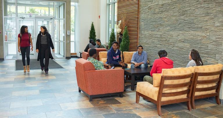 An image of students in the foyer of a building at Royal Roads University.