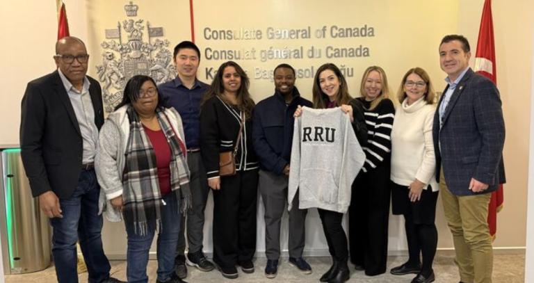 A group of students pose at the Canadian consulate as part of their international residency