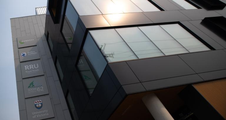 Collaborative campus building at RRU Langford, John Horgan campus showing partner logos and floor to ceiling windows.
