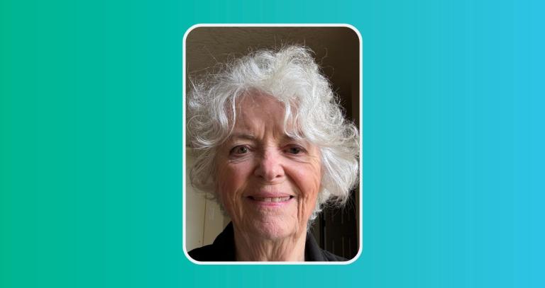 Head shot of Ann Perodeau smiling with a green and blue background