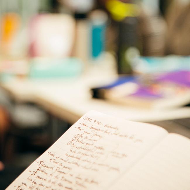 Notebook with writing in it