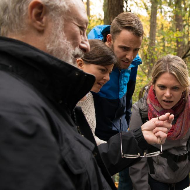 Instructor-holding-insect-to-show-students