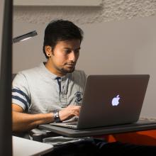Person searching on a laptop