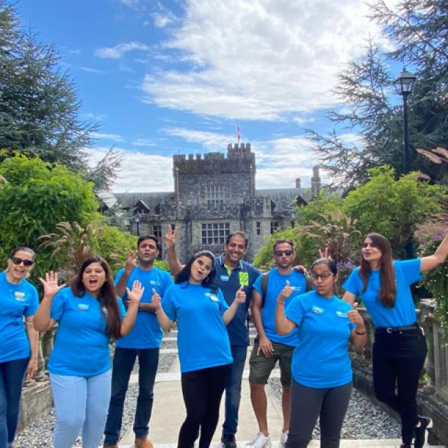 Student volunteers with Hatley Castle in the background.